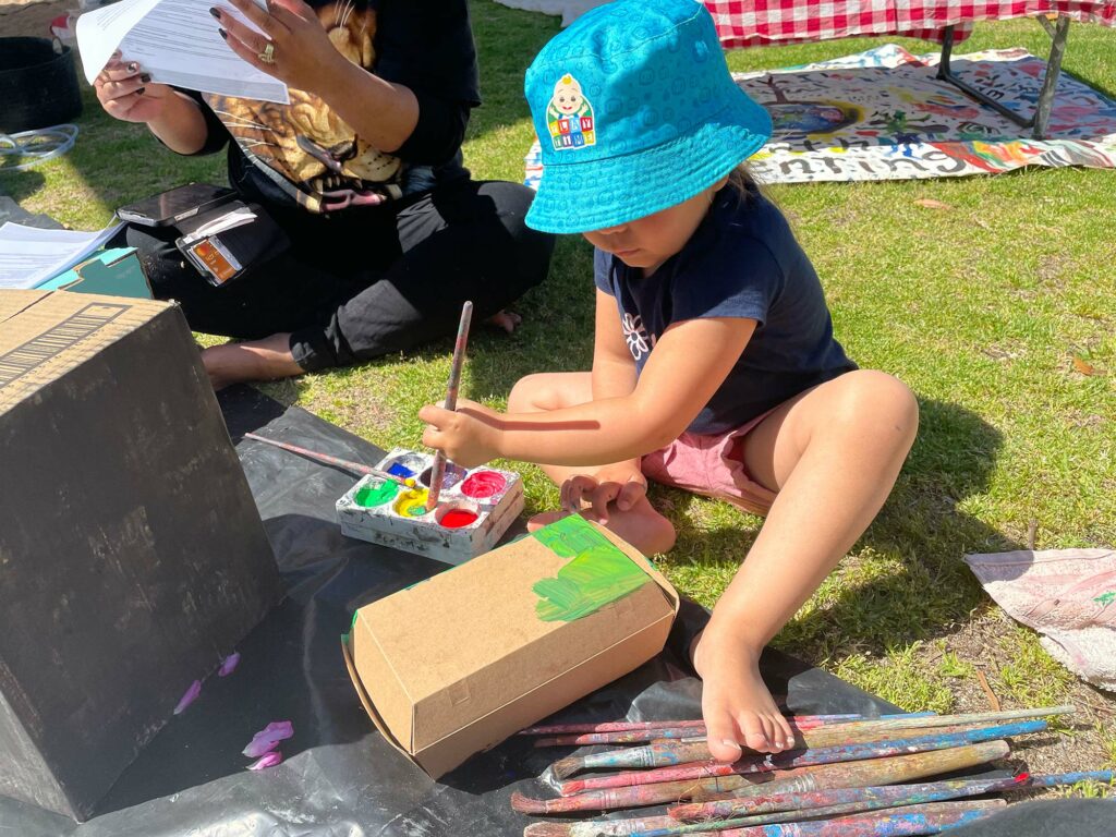 Child experiencing paint play