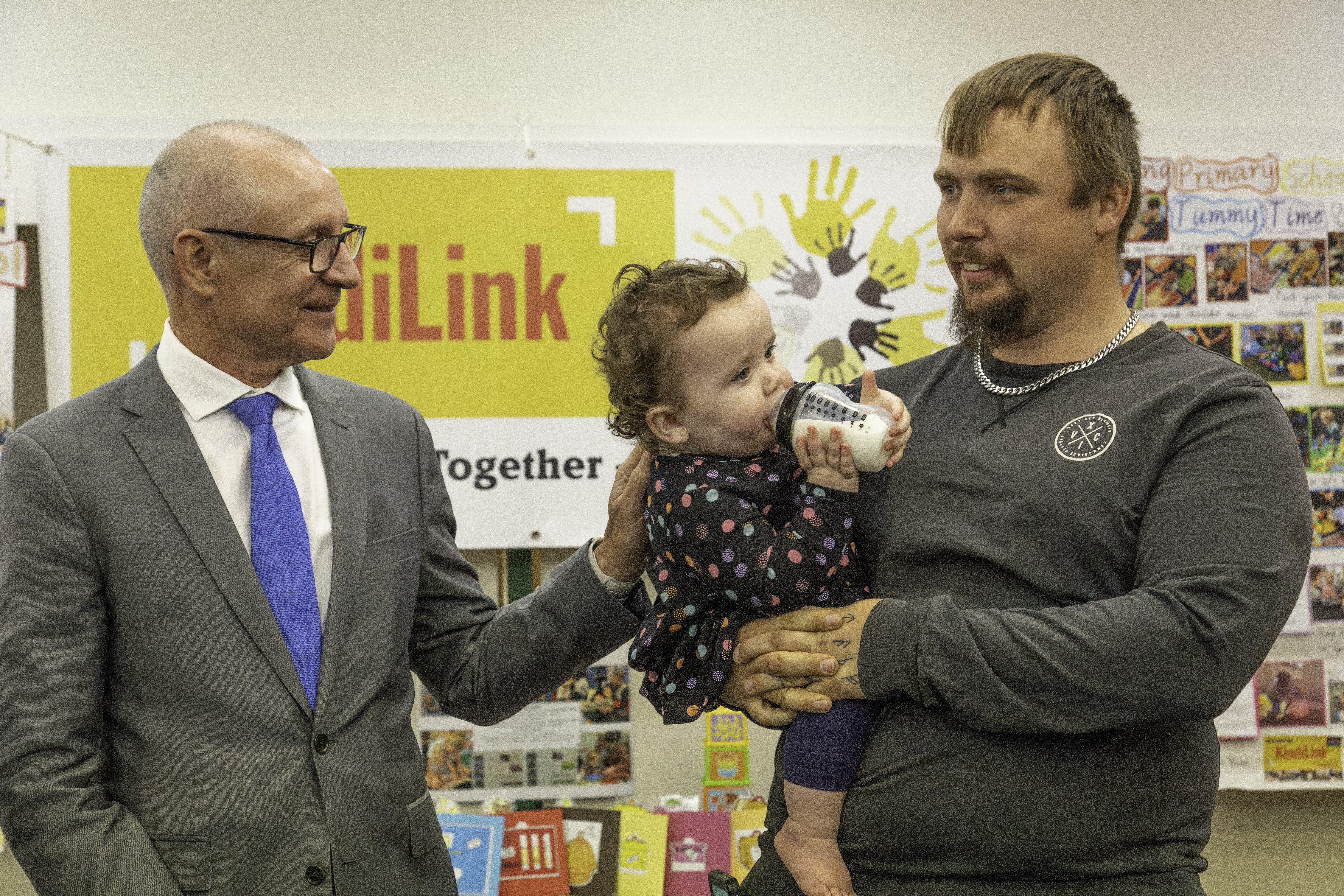 Jay Weatherill interacting with father and small child at launch event