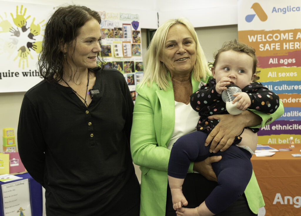 Sabine Winton at CGS program launch holding a child
